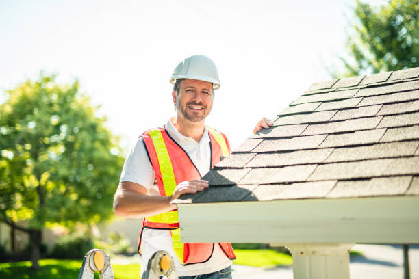 istock man with hard hat standing on steps inspecting house roof 2185914941