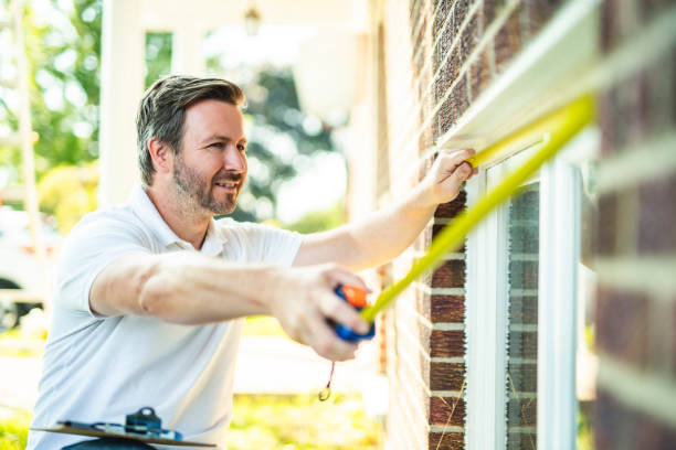 istock Man inspecting house window outside on day light 2185914950