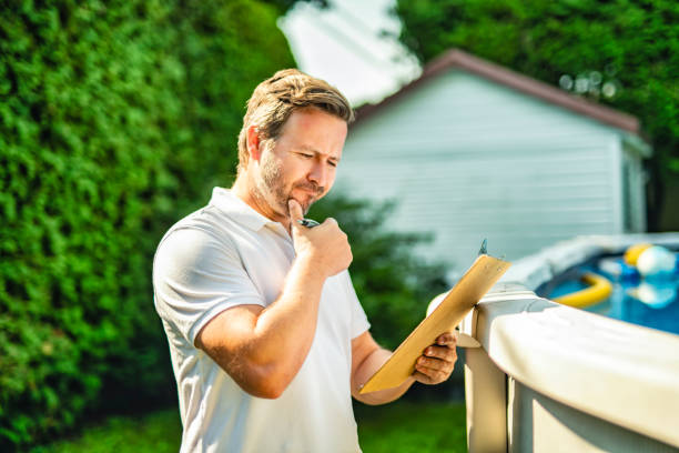 istock engineer inspecting the build of swimming pool. 2185915032