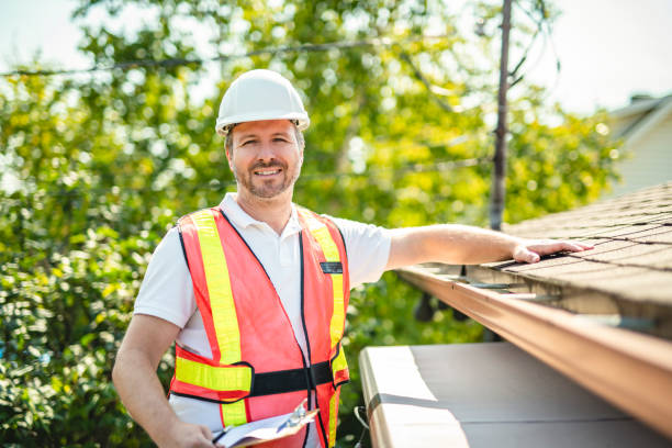 istock man with hard hat standing on steps inspecting house roof 2185916282