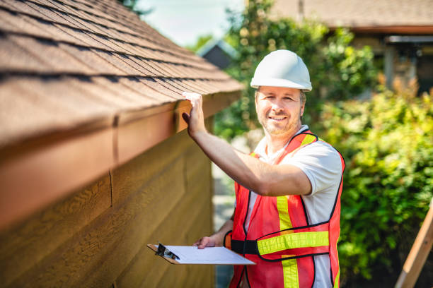 istock man with hard hat standing on steps inspecting house roof 2185916361