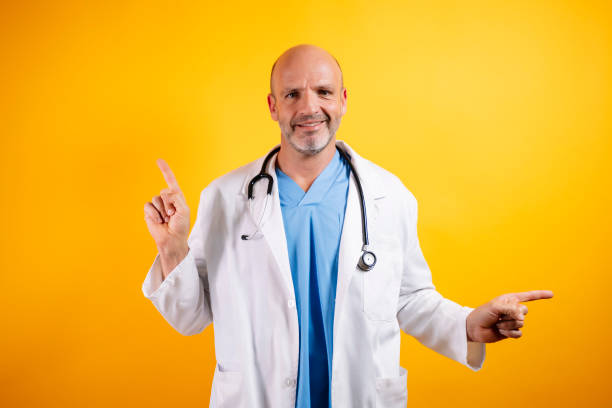 istock A self-assured doctor, pointing to the side. 2185916633