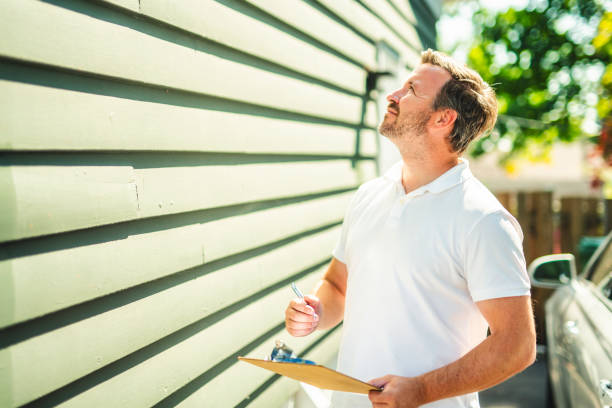 inspector or engineer is checking the building structure and house. After the renovate is complete stock photo