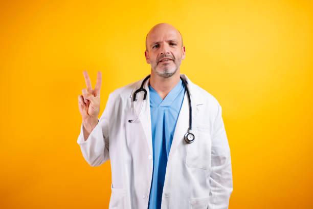 istock A doctor making the V symbol. 2185916687