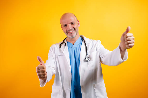 istock A confident doctor, wearing a white coat and holding a stethoscope. 2185916699