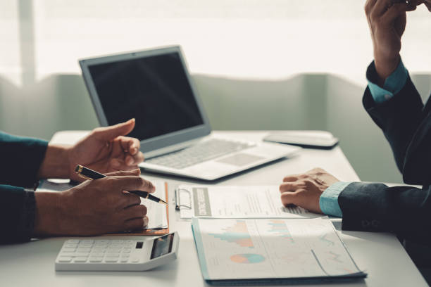 istock Business people discuss charts and graphs showing successful teamwork in data company growth proposal. Analytical statistics, infographics and strategy ideas 2185922842