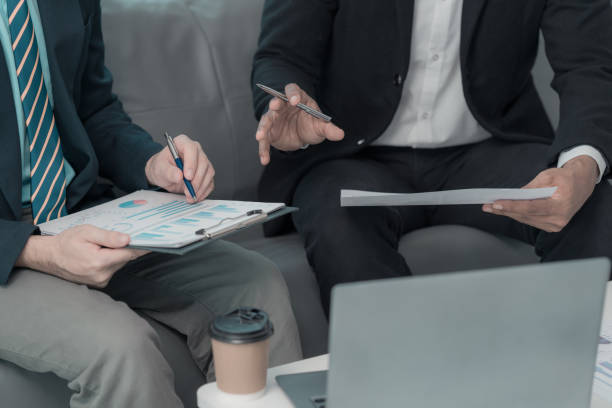 istock Business people discuss charts and graphs showing successful teamwork in data company growth proposal. Analytical statistics, infographics and strategy ideas 2185922881