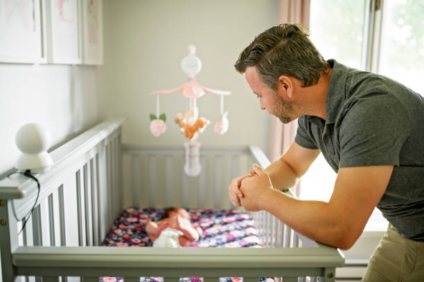istock Tired father with Upset Baby Suffering with Post Natal Depression. 2185927719
