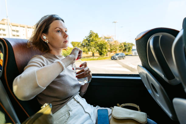 istock Young Woman Drinking Water While Riding A Bus In Palermo In Sicily 2185928316
