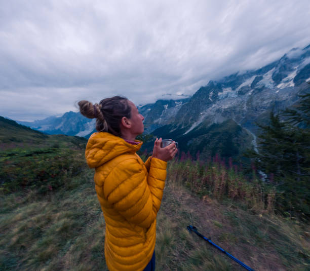 istock Hiker Enjoying a Hot Drink with Mountain View 2185929255