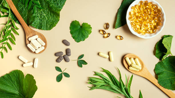 Vegan vitamin capsules and green plants