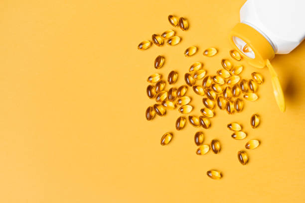 istock Vitamin D3, omega 3 fish oil supplement softgel 2185930766