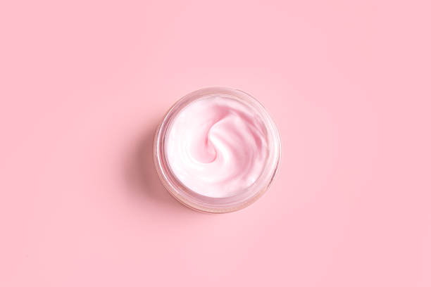 istock Open jar of pink cosmetic cream 2185931061