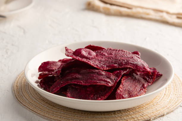 istock Crispy fried sliced purple sweet potato with sugar. 2185934788