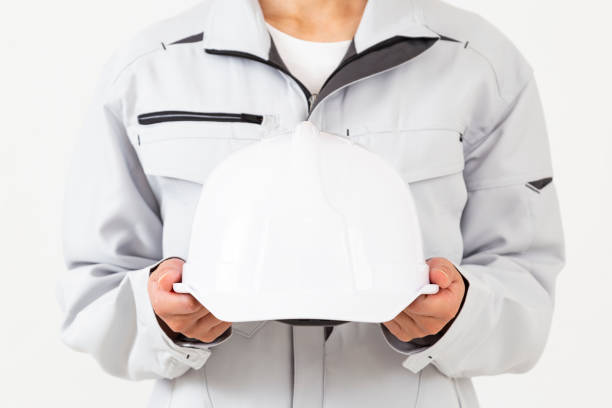 istock A woman in work clothes holding a helmet 2185938387