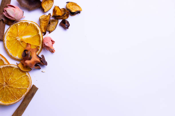 Orange, cinnamon and aromatic petals on a white background. High quality photo