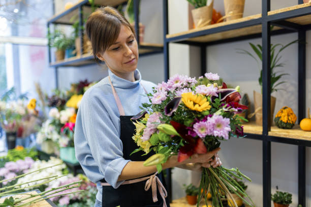istock Florist in her flower shop 2185941254