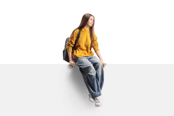 istock Teenage female student sitting on a panel and looking to the side 2185945879