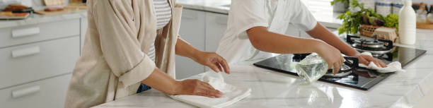 istock Cleaning Modern White Kitchen Together with Cloth Wipes 2185949550