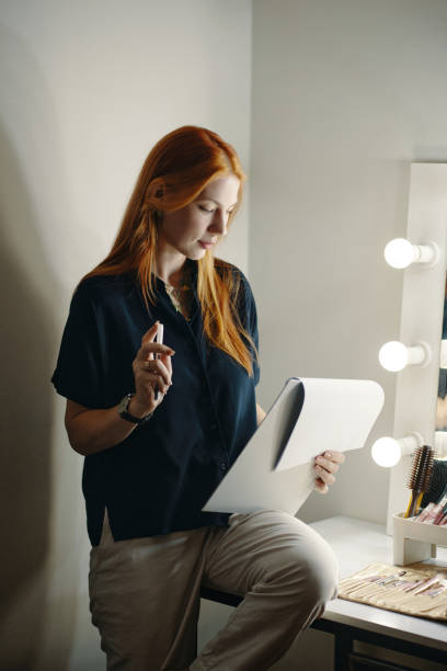 istock While Holding Cup Redheaded Woman Sitting Beside Mirror 2185952494