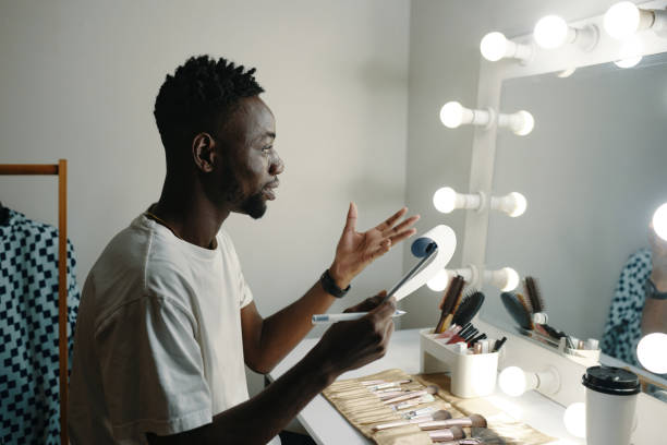 istock Holding Makeup Brush in Front of Vanity Mirror 2185952520