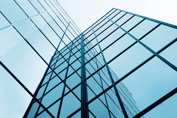 istock Business Building with Glass Windows Reflecting Blue Sky 2185953526