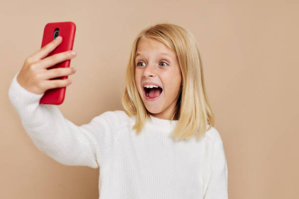 istock happy child talking on the phone technology cropped view 2185953571