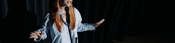 istock Woman Performing Stand-Up Comedy on Stage 2185953630