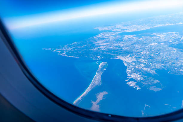 Airplane window with beautiful view of the peninsula