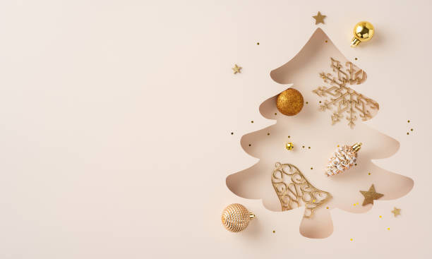 istock Sophisticated Christmas tree cutout decorated with golden ornaments and festive elements, creating an elegant holiday theme. Perfect for Merry Christmas and Happy New Year celebrations 2185957239