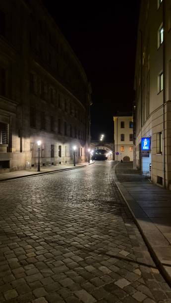 istock narrow street rocky road illuminated by lanterns 2185958048