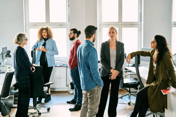 istock Business people having casual discussing at startup office 2185972362