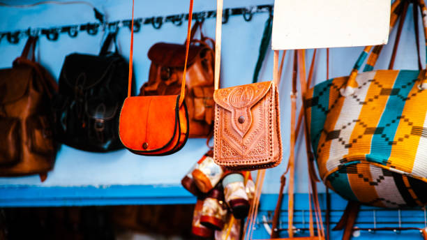 istock Handcrafted leather bags hanging in a souk in Chefchaouen, Morocco. 2185973252