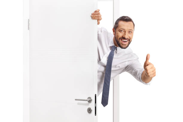istock Cheerful businessman opening a door 2185976781