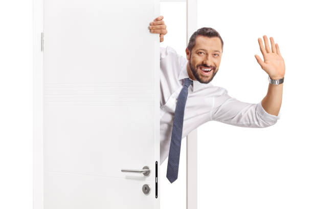 istock Cheerful businessman opening a door 2185977489