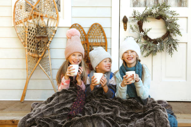 istock Children on a Charming Rustic Porch with Hot Chocolate 2185978224