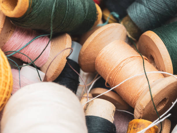 Multicolored Sewing Thread Spools: Vibrant hues are perfect for creating unique textiles and projects