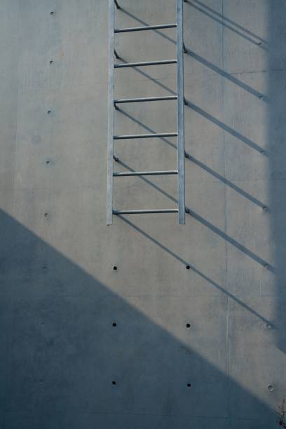 istock Metal ladder on concrete wall 2185978447