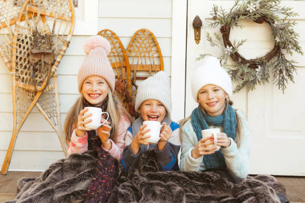 istock Children on a Charming Rustic Porch with Hot Chocolate 2185979421