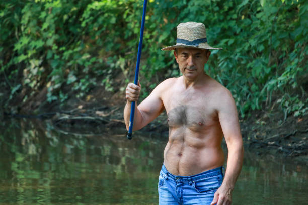 Middle age woman fishing in the lake