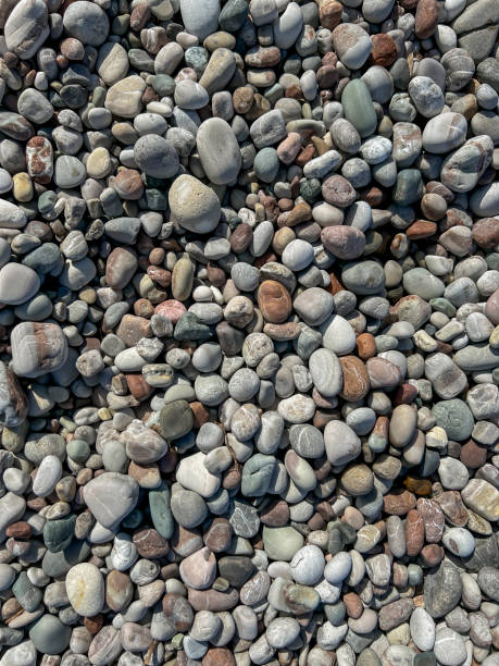 Surrounding stones lying on a rocky beach as a background