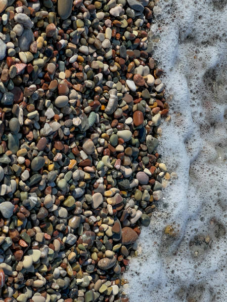 Surrounding stones lying on a rocky beach as a background