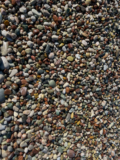 Surrounding stones lying on a rocky beach as a background