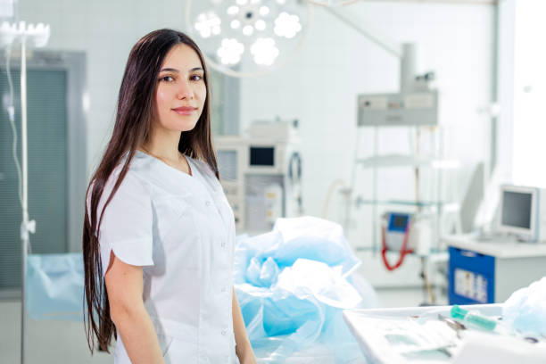 istock attarctive female surgeon with long black hair posing with her uniform 2185986061