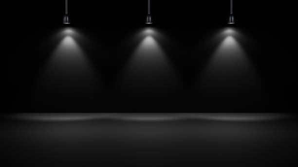 istock Three white spotlights illuminate a black background, creating a minimalist and dramatic environment 2185987271