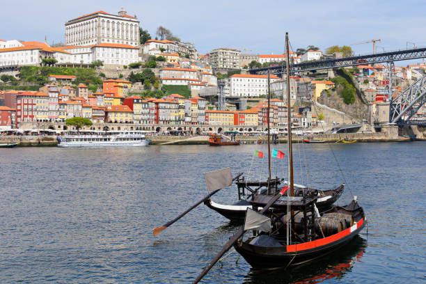 daytime view of Porto and the rabelo boats on the Douro river (Portugal).