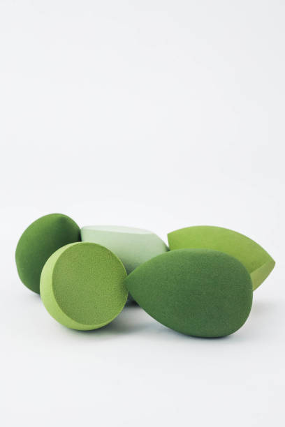 istock Green makeup sponges on a white background. A minimalist composition showcasing beauty tools for foundation blending, perfect for skincare and cosmetics themes 2185990629