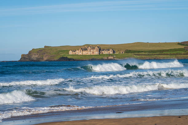 istock Waves crashing at Portballintrae beach on sunny day 2185994433