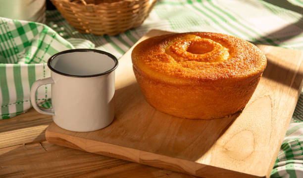 istock Orange cake, a beautiful sunny breakfast table and delicious Orange cake, selective focus. 2185995290