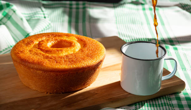 istock Orange cake, a beautiful sunny breakfast table and delicious Orange cake, selective focus. 2185995637